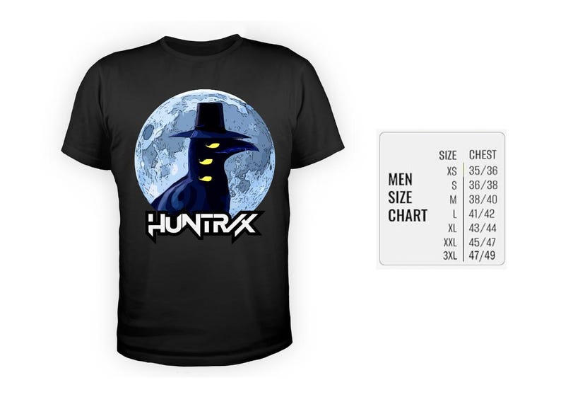 May include: Black t-shirt featuring a graphic of a dark figure with a hat and glowing yellow eyes against a blue moon backdrop. The word "HUNTRAX" is displayed in white, stylized text. A size chart is visible.