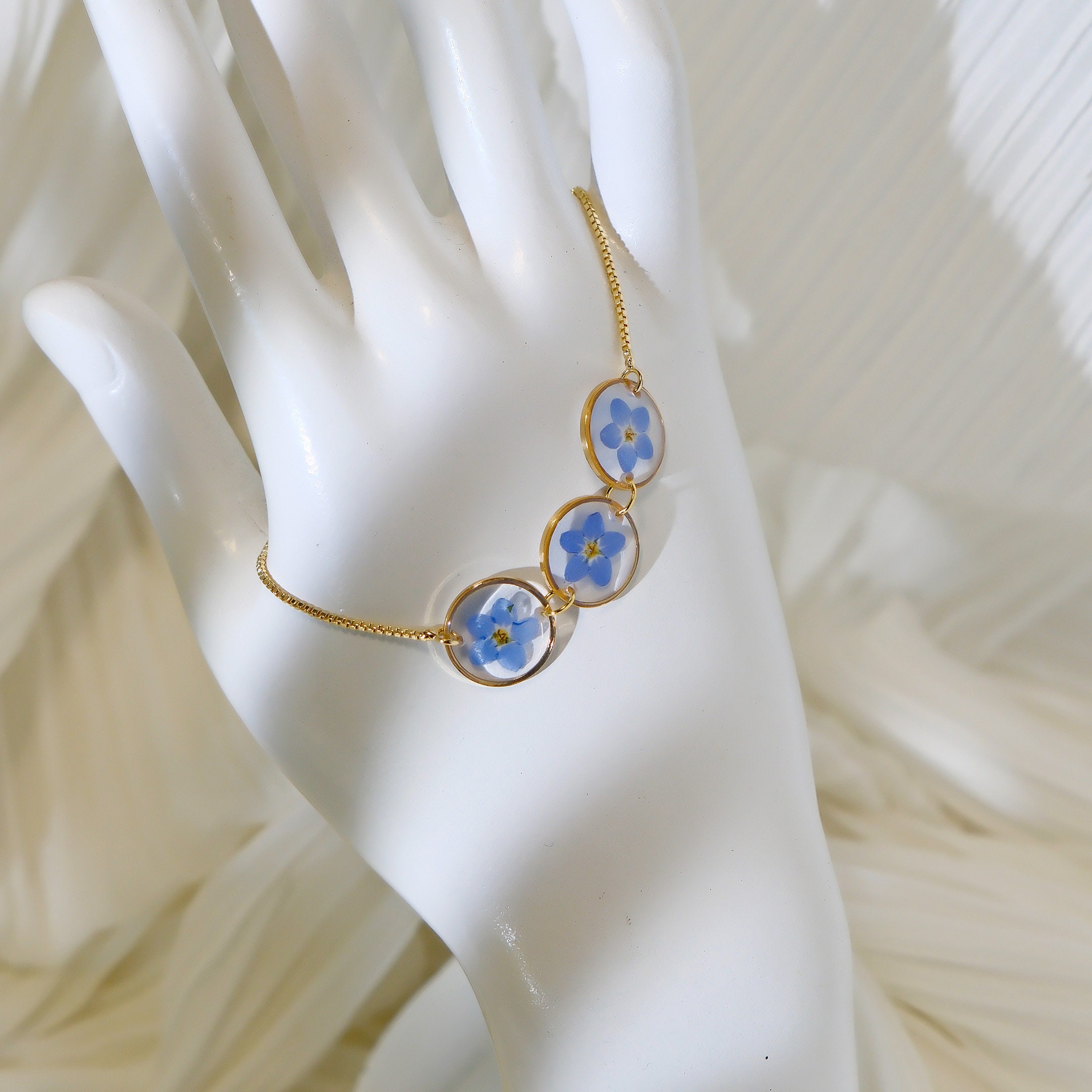 Bracciale con fiori selvatici nontiscordardime in acciaio