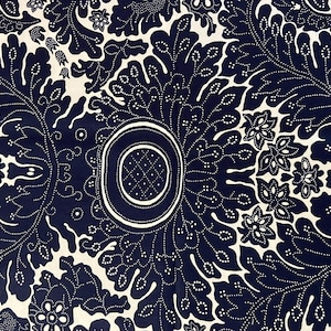 May include: A fabric textile featuring a dark navy blue background with a repeating cream-colored botanical pattern. The design consists of large, intricate acanthus-style leaves and floral motifs outlined with fine white dots and lines.