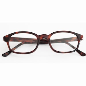 May include: Tortoise shell eyeglasses with a rounded rectangular frame and clear lenses.