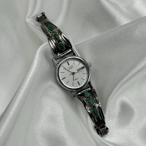 Silver and Turquoise Citizen Round Dial Watch