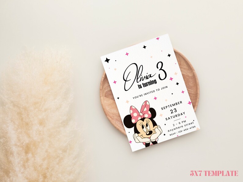 May include: A printable 5x7 inch invitation template featuring a cartoon image of Minnie Mouse with pink and black polka dots. The text on the invitation reads "Olivia is turning 3. You're invited to join. September 23, Saturday, 2-6 PM, Anywhere street, RSVP: 125-436-4789".