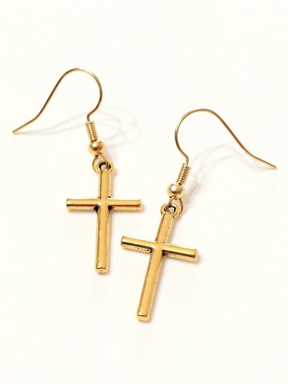Cross earrings meaning hot sale