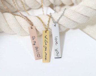 May include: Three silver bar necklaces with different handwritten messages: "Love you", "I love you more", and "Be my Still I ♥".