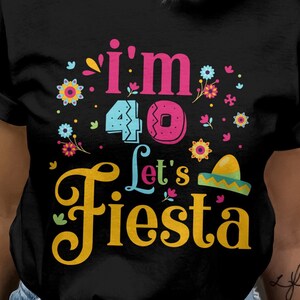 May include: Black t-shirt with a colorful graphic that says "I'm 40 Let's Fiesta". The graphic features a colorful number 40, a donut, and a sombrero.