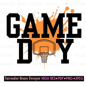 May include: A graphic design featuring the words "GAME DAY" in bold black letters, with an orange splatter effect behind the text. A basketball hoop is centered below the text. The design includes the text "Lavender Grace Designs".