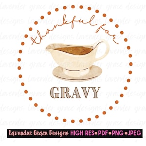 May include: A white gravy boat with brown gravy inside, sitting on a white saucer. The boat is surrounded by a brown dotted circle with the text "thankful for GRAVY" in brown lettering.