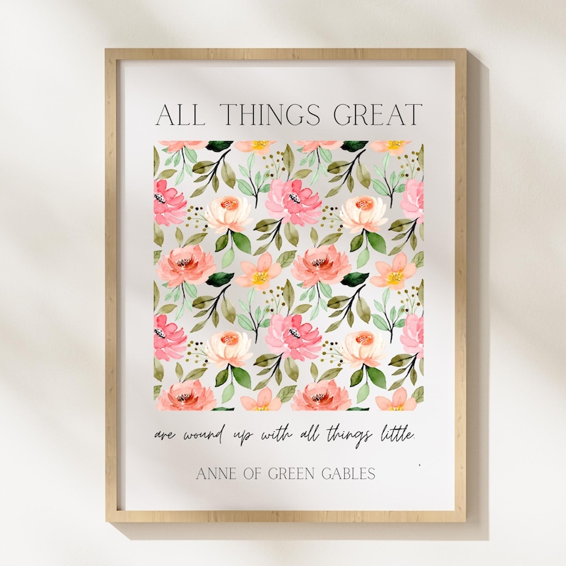 May include: Framed art print featuring a floral pattern of pink, peach, and yellow watercolor flowers with green leaves on a light gray background. The text "ALL THINGS GREAT" and a quote from "ANNE OF GREEN GABLES" are printed above and below the floral design.