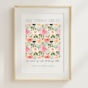 May include: A framed print featuring the quote "ALL THINGS GREAT are wound up with all things little. ANNE OF GREEN GABLES." The print has a floral pattern in pink, peach, and yellow, with green leaves on a light gray background. The frame is a light wood color.