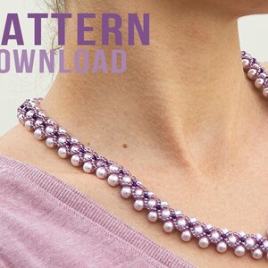 May include: A beaded necklace with white pearls and purple beads. The necklace is worn around the neck. The words "PATTERN DOWNLOAD" are in purple text in the upper left corner. The necklace is a V-shape.