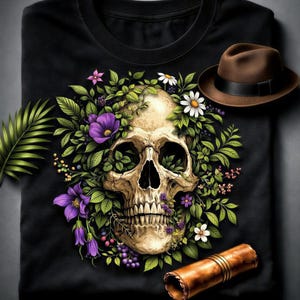 a skull design on a black t-shirt, surrounded by a variety of colorful flowers and leaves. A brown hat is also present in the scene.