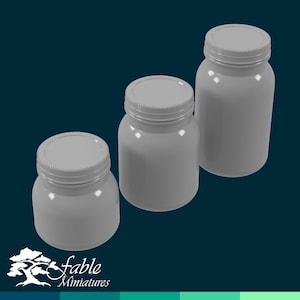 May include: Three gray glass jars with lids, arranged in descending size order. The jars are empty and have a smooth, glossy finish.