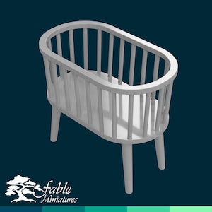 May include: White wooden crib with a rounded shape and slatted sides. The crib has four legs and is designed for a doll or miniature figure.