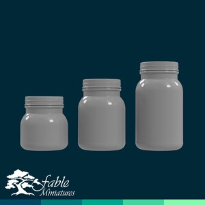 May include: Three gray glass jars with lids of varying sizes. The jars are empty and have a smooth, glossy finish.