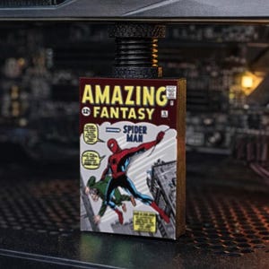 May include: A computer case interior featuring a GeForce RTX graphics card and a vintage "Amazing Fantasy" Spider-Man comic book. The comic book is red, white, and yellow.