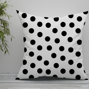 A polka dot cushion shown in this image displaying one of the seamless patterns included.