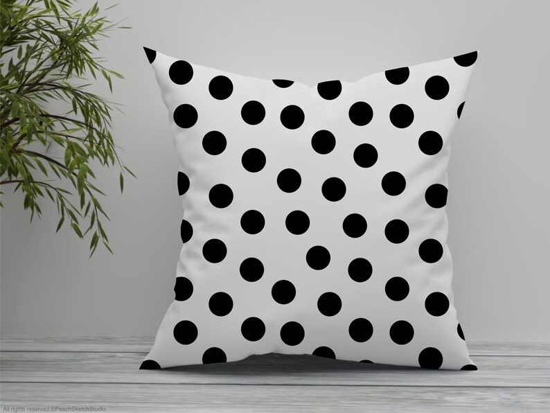 A polka dot cushion shown in this image displaying one of the seamless patterns included.
