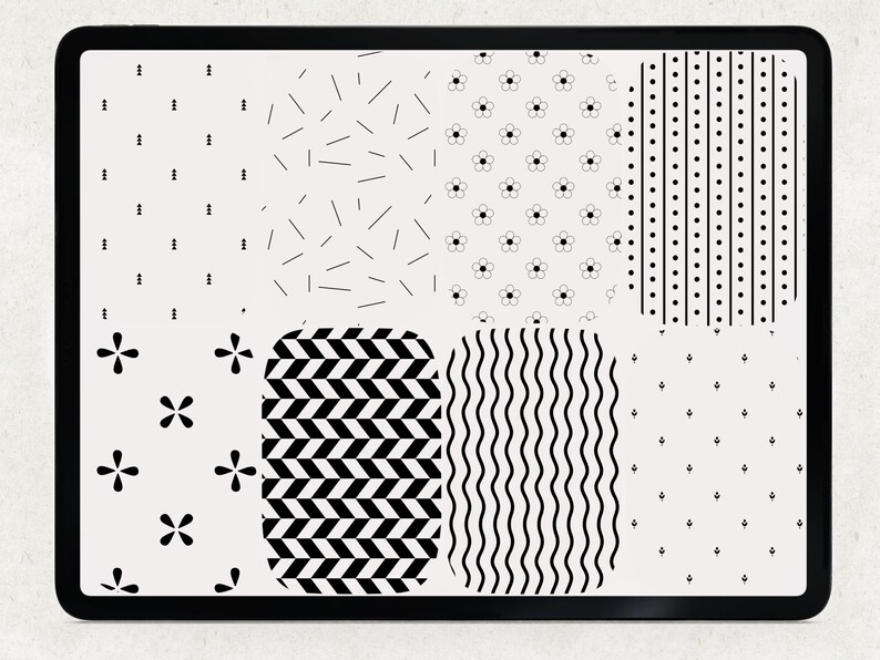 A digital tablet screen displaying a variety of black and white geometric patterns. The patterns include small flowers, lines, dots, and wavy lines.