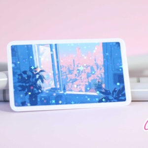 Puede incluir: Una pegatina hologr&aacute;fica que muestra una vista de la ciudad desde una ventana, con un esquema de color rosa y azul. La pegatina tiene un borde blanco y est&aacute; rodeada de marcadores.
