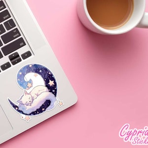 May include: A white cat sleeps on a crescent moon with a starry sky background. The moon is blue and purple with white stars. The cat is curled up on the moon with its eyes closed. The sticker is on a laptop.