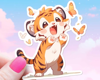 May include: A cute cartoon tiger cub with orange and black stripes is standing on its hind legs with its paws raised. The tiger is smiling and has its mouth open. There are several yellow butterflies flying around the tiger.