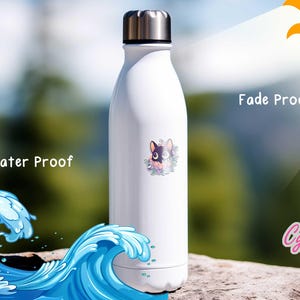 May include: White stainless steel water bottle with a black and white cartoon dog sticker. The sticker is surrounded by flowers. The bottle is water and fade proof. The text "Water Proof" and "Fade Proof" are visible in the image. The text "Cypriana Stickers" is also visible in the image.