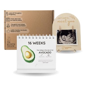 May include: A pregnancy milestone kit including a brown cardboard box with printed text, a white spiral-bound calendar showing 16 weeks with an avocado illustration, and an arched wooden display stand holding a black and white ultrasound image.