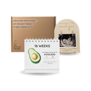 May include: A brown cardboard box labeled The Growing Miracle, a white spiral-bound calendar showing 16 weeks and an avocado, and an arched wooden display stand holding a black and white ultrasound image with the text can't wait to meet you.
