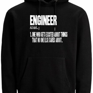 May include: Black hooded sweatshirt with a front pocket and a drawstring hood. The white text on the front says "ENGINEER noun. 1. ONE WHO GETS EXCITED ABOUT THINGS THAT NO ONE ELSE CARES ABOUT."
