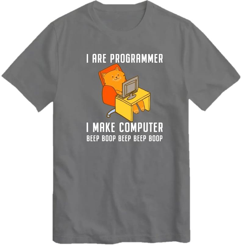 May include: A gray t-shirt with a cartoon cat sitting in a chair and using a computer. The text on the shirt reads "I are programmer I make computer beep boop beep beep boop".