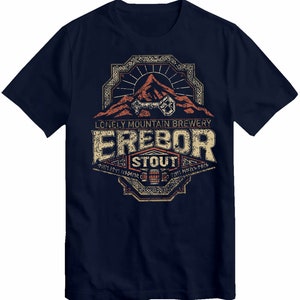 May include: Navy blue t-shirt featuring a vintage-style graphic of a mountain with a keyhole, text that reads "Lonely Mountain Brewery Erebor Stout", and a design of a beer mug.