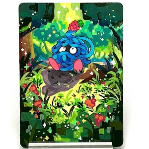 May include: An illustrated card featuring a cartoon character with a pink berry on its head. The character is sitting on a rock surrounded by green grass and flowers.