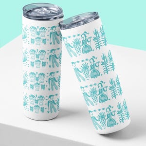 May include: Two white insulated tumblers with a teal pattern featuring figures, pineapples, and floral elements. Each tumbler has a clear lid. The design is repeated around the body of the tumblers.