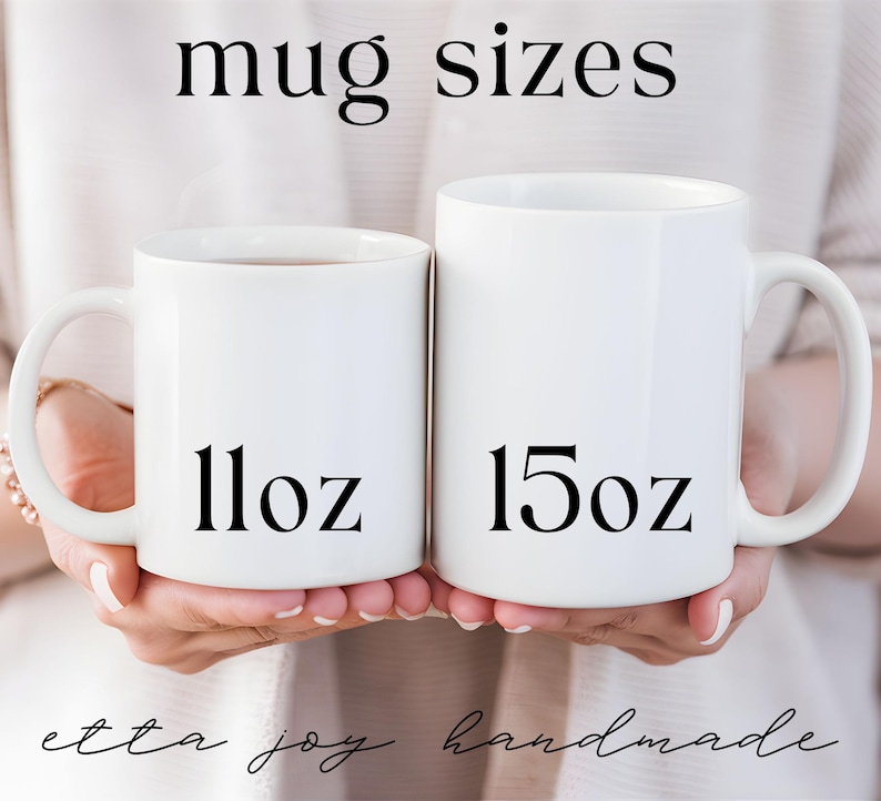 two white coffee mugs with numbers on them