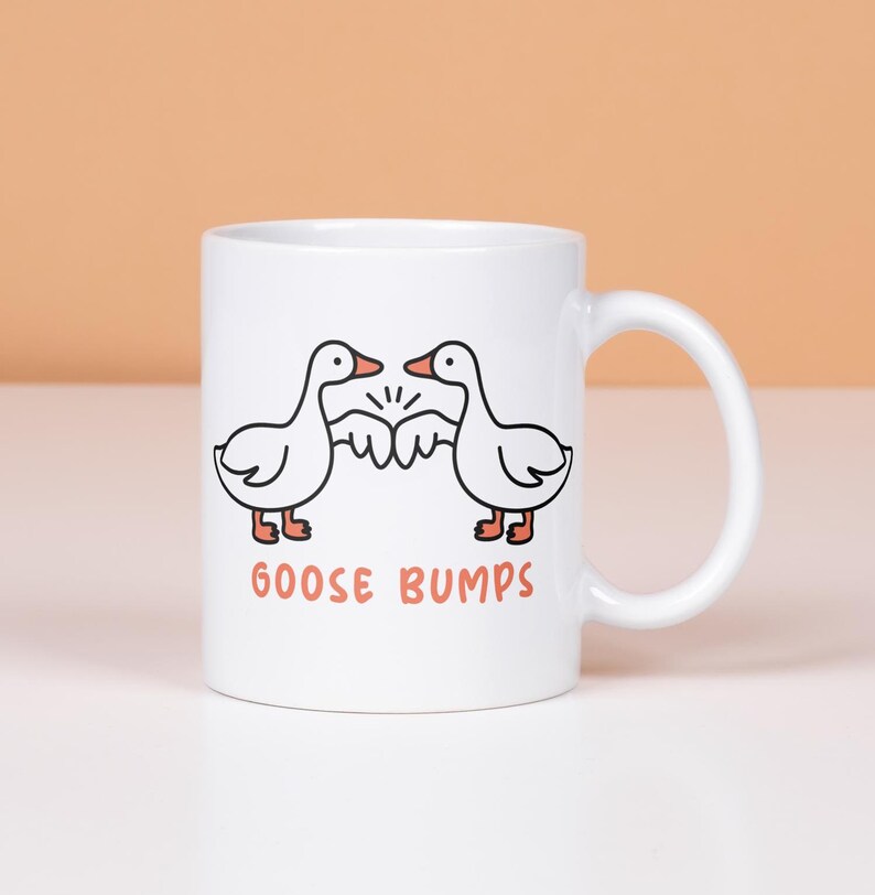 Goose Bumps mug.  2 geese first bumping