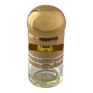 May include: A small, clear glass bottle with a gold cap and a gold label that says "Neroli".