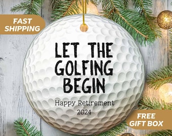 May include: White golf ball bauble with black text that reads "Let the golfing begin Happy Retirement 2024".