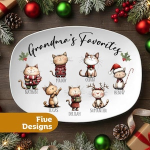 May include: White oval serving platter with the text "Grandma's Favorites" and illustrations of seven cartoon cats. Each cat is wearing a different outfit, including a Santa hat and a scarf. The text "Five Designs" is also visible.