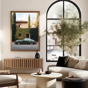 Elegant photograph of a green Porsche 911 parked in front of an ivy-covered Italian villa with cypress trees — luxury car wall art print.
