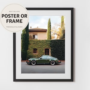 Elegant photograph of a green Porsche 911 parked in front of an ivy-covered Italian villa with cypress trees — luxury car wall art print.