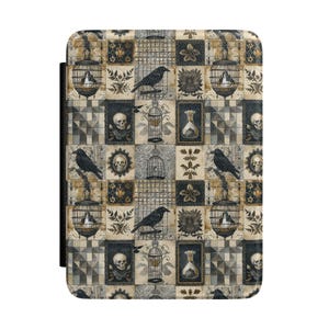 May include: A rectangular e-reader case featuring a repeating pattern of black crows, ornate birdcages, human skulls, glass apothecary bottles, and botanical floral motifs in shades of black, grey, beige, and muted gold on a textured surface.