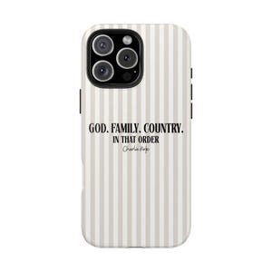 May include: A phone case with a vertical striped pattern in beige and white. The case features the text "GOD. FAMILY. COUNTRY. IN THAT ORDER" and the signature "Charlie Kirk" in black.