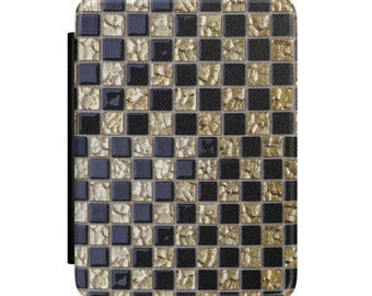 May include: A rectangular protective case for an electronic device featuring a repeating grid pattern of alternating solid black squares and textured metallic gold squares, creating a high-contrast mosaic effect across the entire front surface.