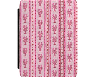 May include: A pink and white patterned case with a repeating design of pink lobsters, stars, and hearts. The case has a black strap on the left side. The overall theme is nautical.