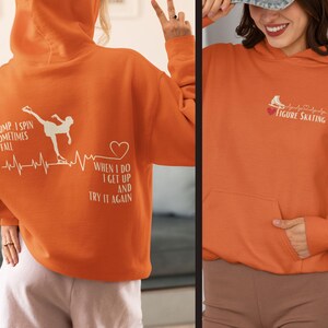 May include: Orange hoodie with a figure skater graphic and the text "I jump I spin sometimes I fall when I do I get up and try it again". The hoodie also has a heart graphic and a heartbeat line. The second hoodie is orange with a figure skate graphic and the text "Figure Skating" with a heart graphic.