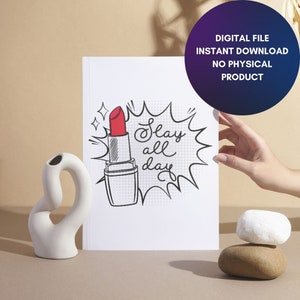 May include: A white printable art print with a black and white illustration of a lipstick with the text "Slay all day" in a black speech bubble.