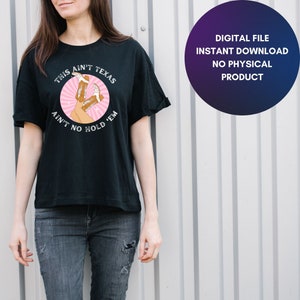May include: A black t-shirt with a pink circle graphic featuring a pair of cowboy boots and the text "THIS AIN'T TEXAS AIN'T NO HOLD 'EM".