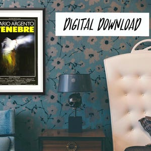 May include: A digital download of a movie poster for the film "Tenebrae" directed by Dario Argento. The poster features a woman with long, dark hair and a white dress, standing in a dark room with a red stain on her chest. The poster is framed in black and has a white background.