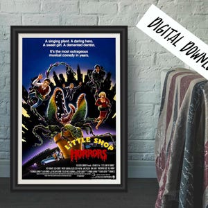 May include: Framed poster for the musical comedy "Little Shop of Horrors." The poster features a large, menacing plant with people running away. Text includes "A singing plant. A daring hero." and "DIGITAL DOWNLOAD."