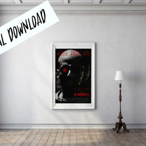 May include: A framed poster for the film "12 Monkeys" with Bruce Willis and Brad Pitt. The poster has a dark design with red details. The words "DIGITAL DOWNLOAD" are written across the top left corner.